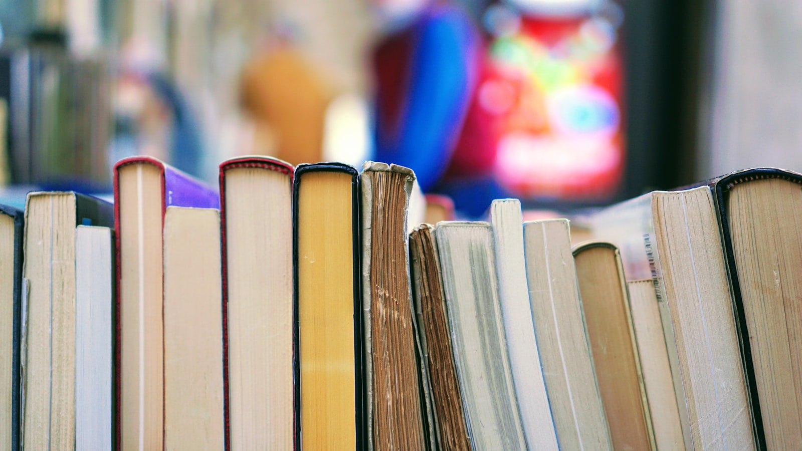 A stack of books on a desk.