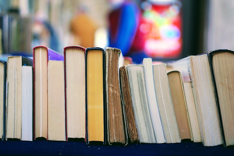 A stack of books on a desk.